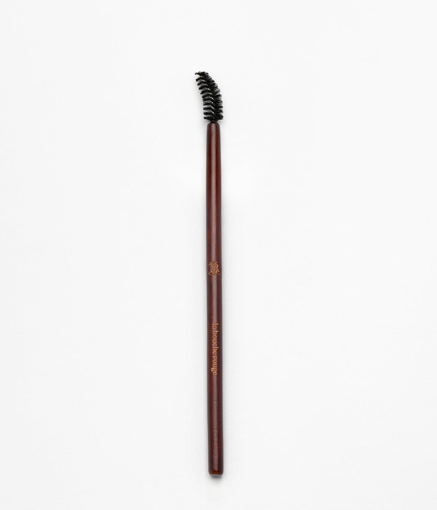 Brosse à sourcils La Bouche Rouge Paris, outil pour peigner et définir les sourcils, image montrant la brosse en détail.