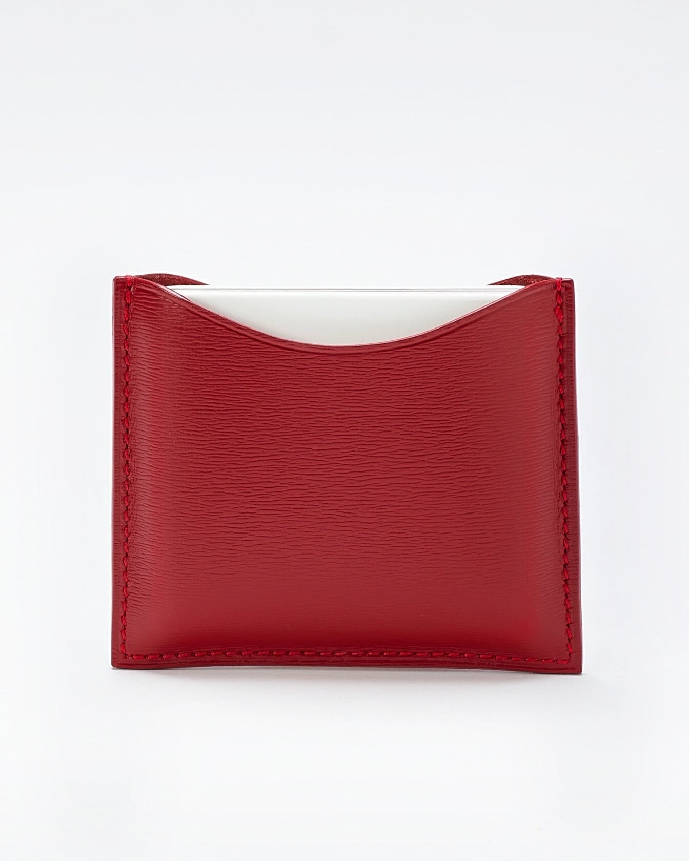 Poudrier rechargeable en cuir de La Bouche Rouge Paris, élégant et compact, avec compartiments pour le maquillage.