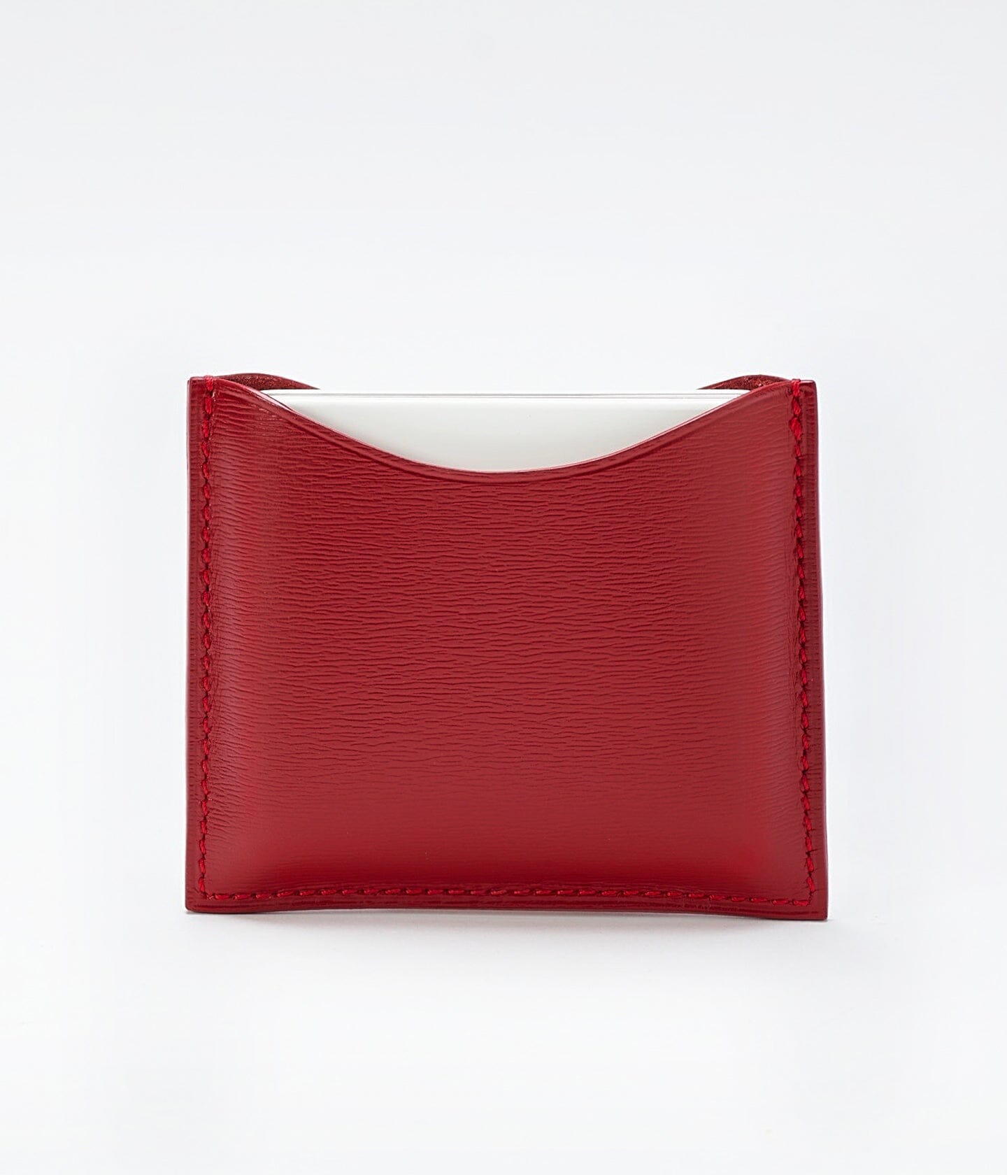 Poudrier rechargeable en cuir de La Bouche Rouge Paris, élégant et compact, avec compartiments pour le maquillage.