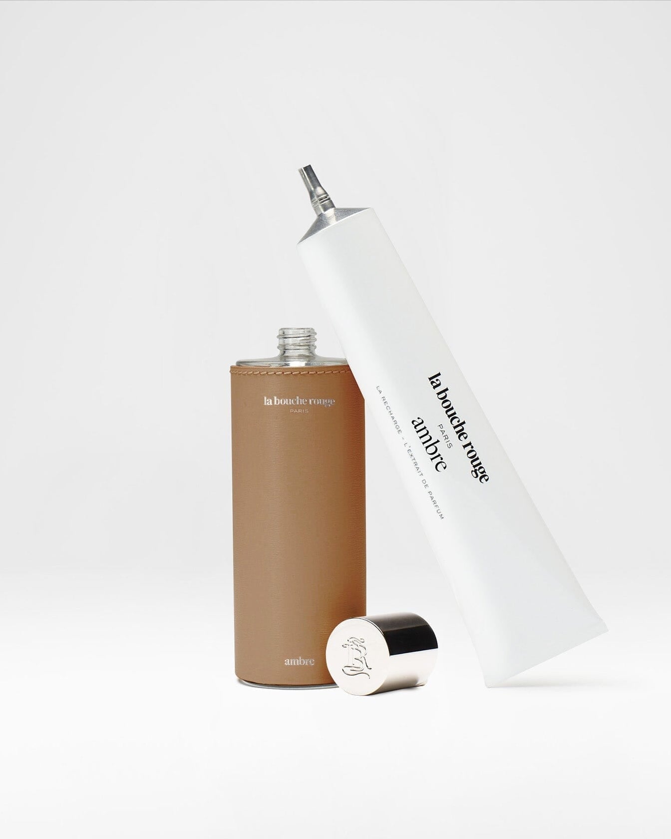 Recharge d'extrait de parfum Ambre La Bouche Rouge Paris en flacon de 100ml, contenant un parfum élégant et aromatique.