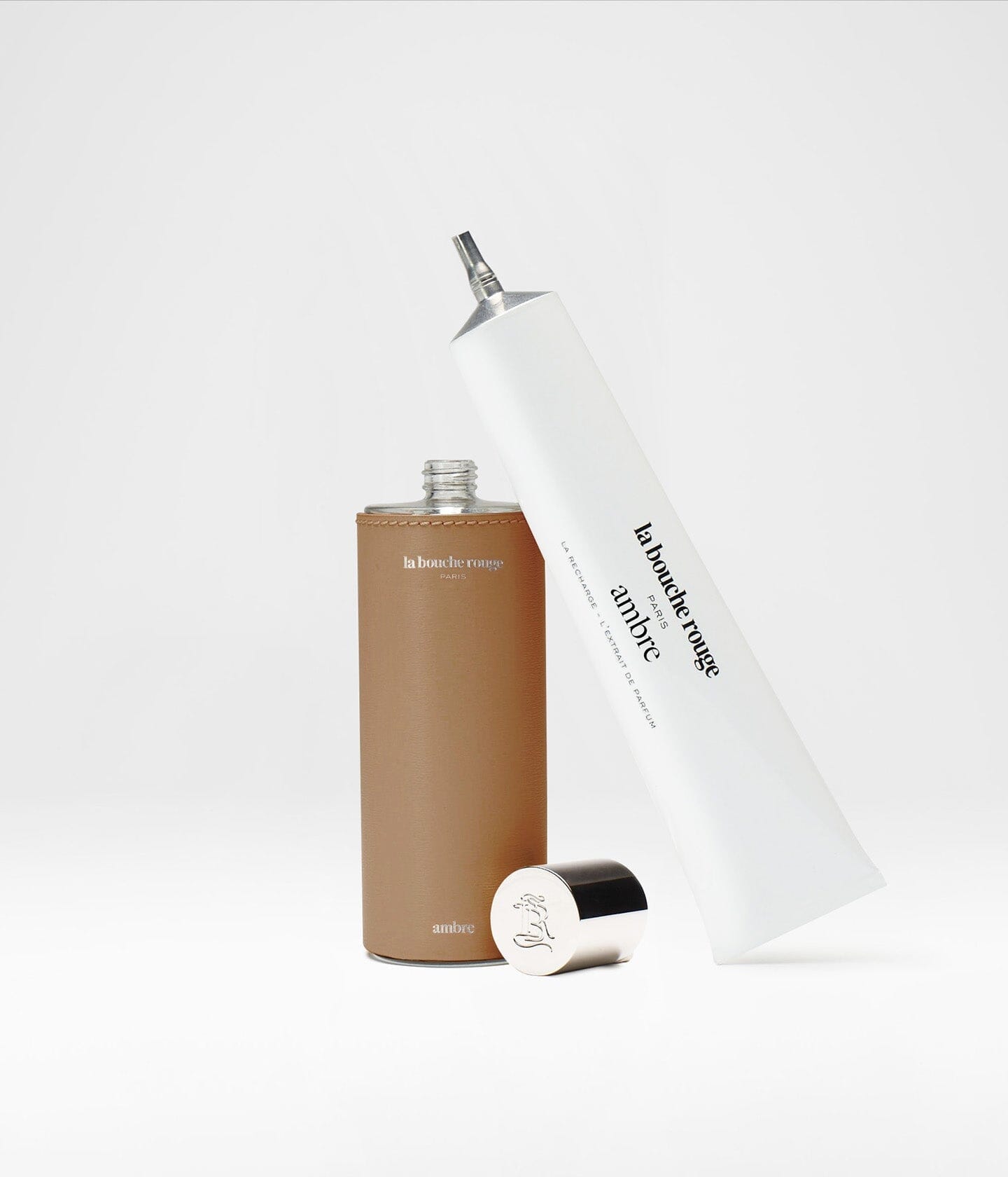 Recharge d'extrait de parfum Ambre La Bouche Rouge Paris en flacon de 100ml, contenant un parfum élégant et aromatique.