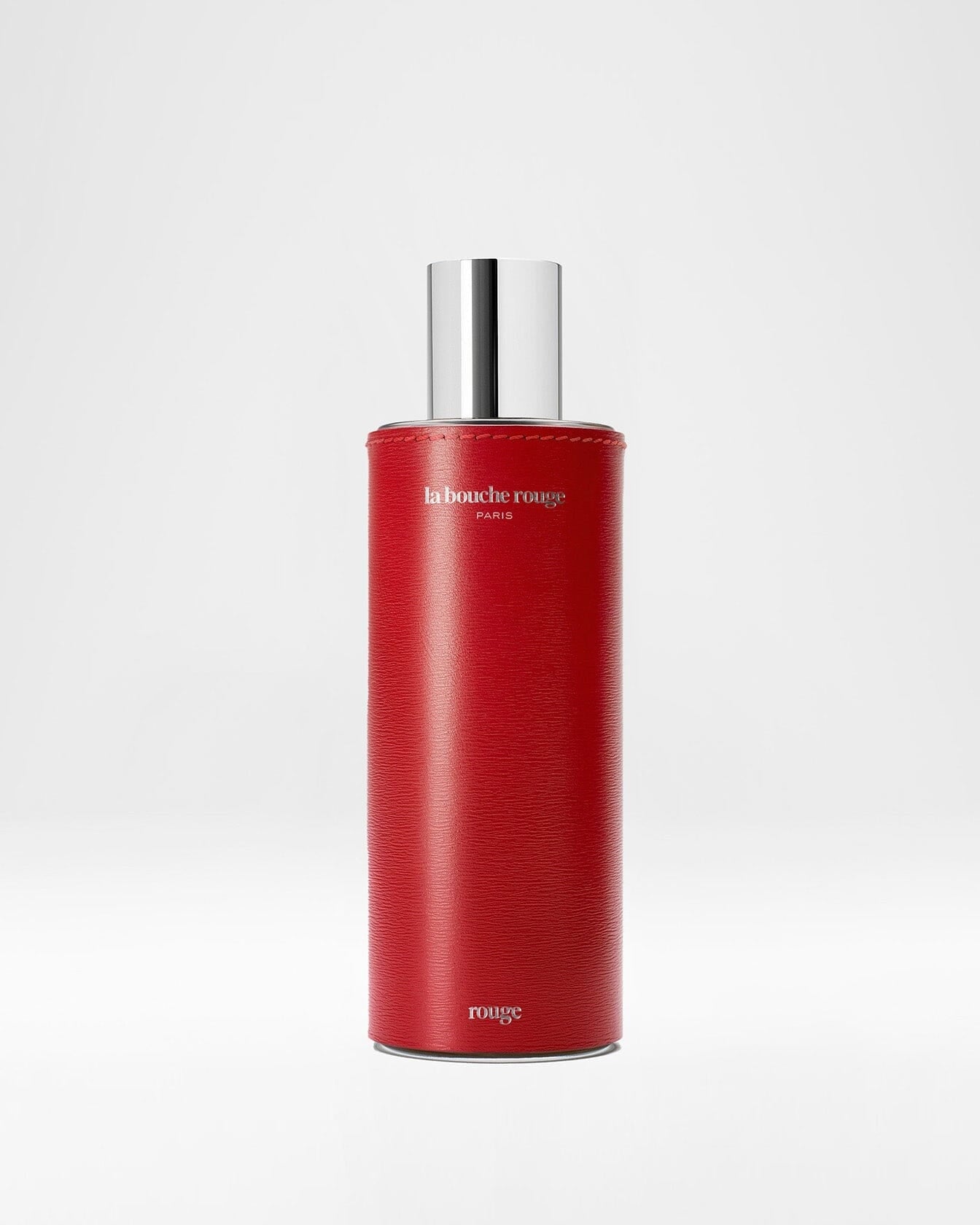 Flacon de parfum Rouge La Bouche Rouge Paris, extrait de parfum 100ml avec design élégant en verre rouge.