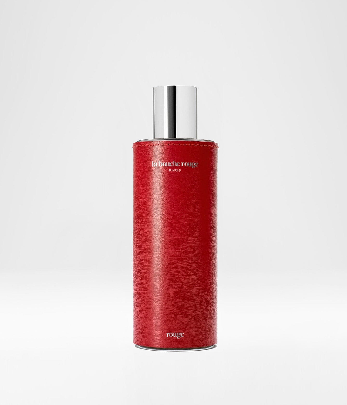Flacon de parfum Rouge La Bouche Rouge Paris, extrait de parfum 100ml avec design élégant en verre rouge.