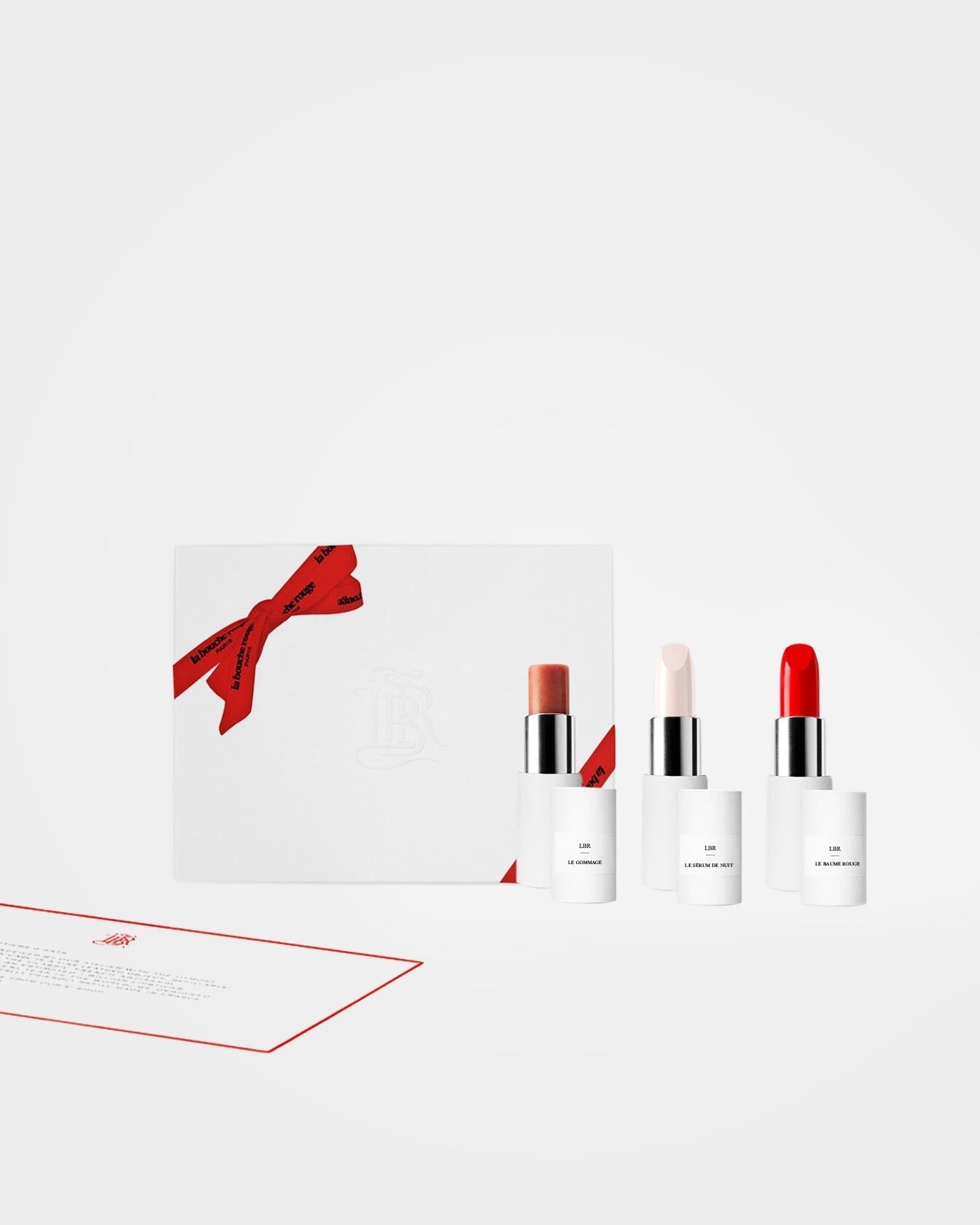 Coffret soin des lèvres La Bouche Rouge Paris avec produits de maquillage et soins pour lèvres dans un emballage élégant.