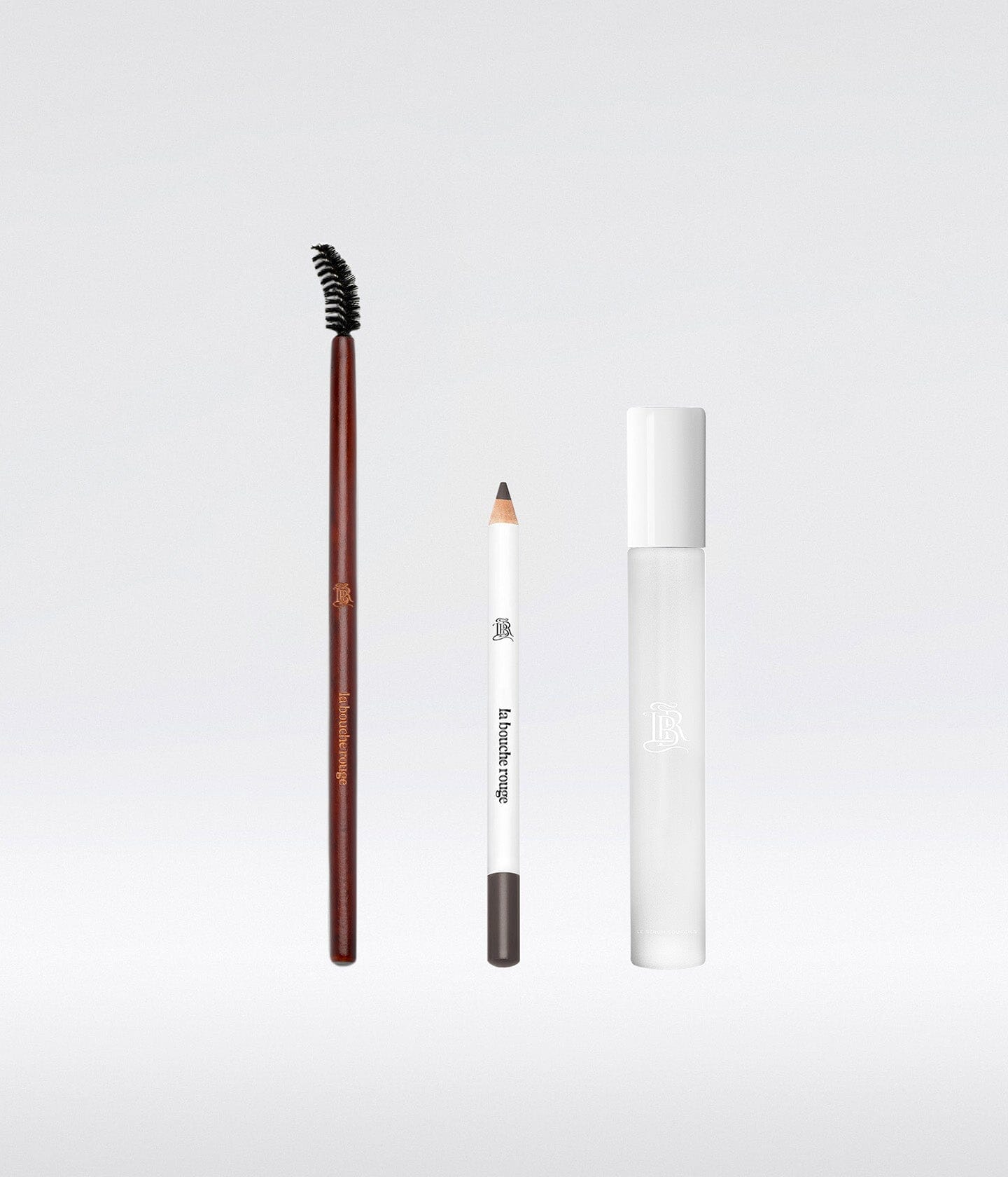 Coffret maquillage pour sourcils La Bouche Rouge Paris avec pince à épiler, pinceau et produits pour sourcils noirs.