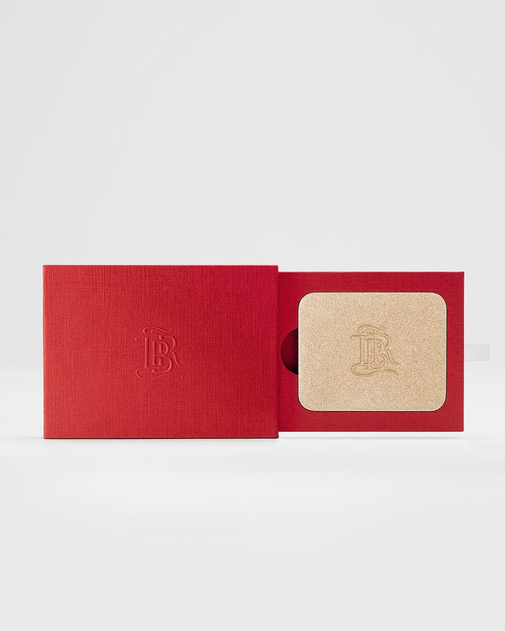 Poudre enlumineur La Lumière de La Bouche Rouge Paris, finition naturelle, visible dans son flacon élégant avec packaging minimaliste.