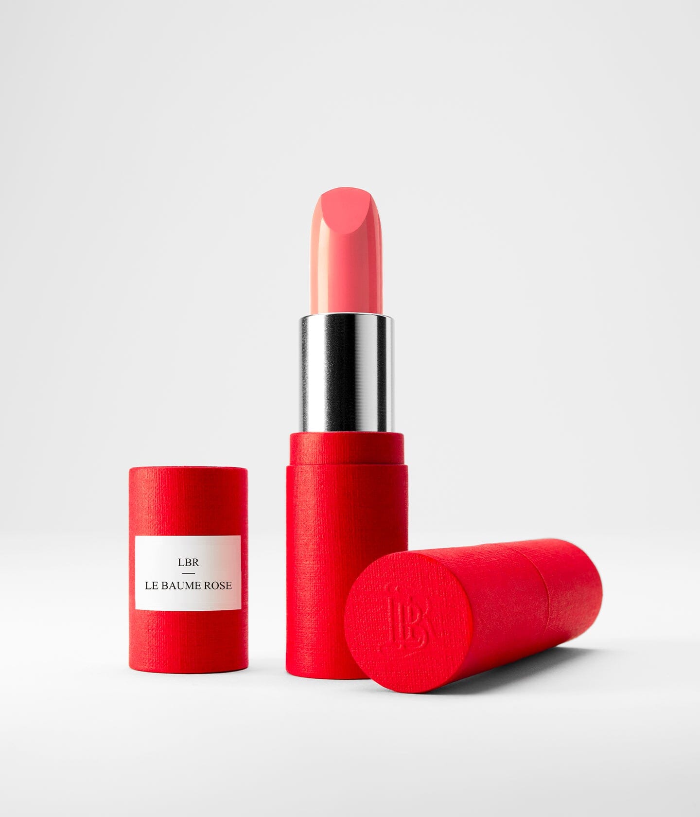Baume à lèvres La Bouche Rouge Paris, soin des lèvres avec tube rechargeable, fini rose, application douce et hydratante.