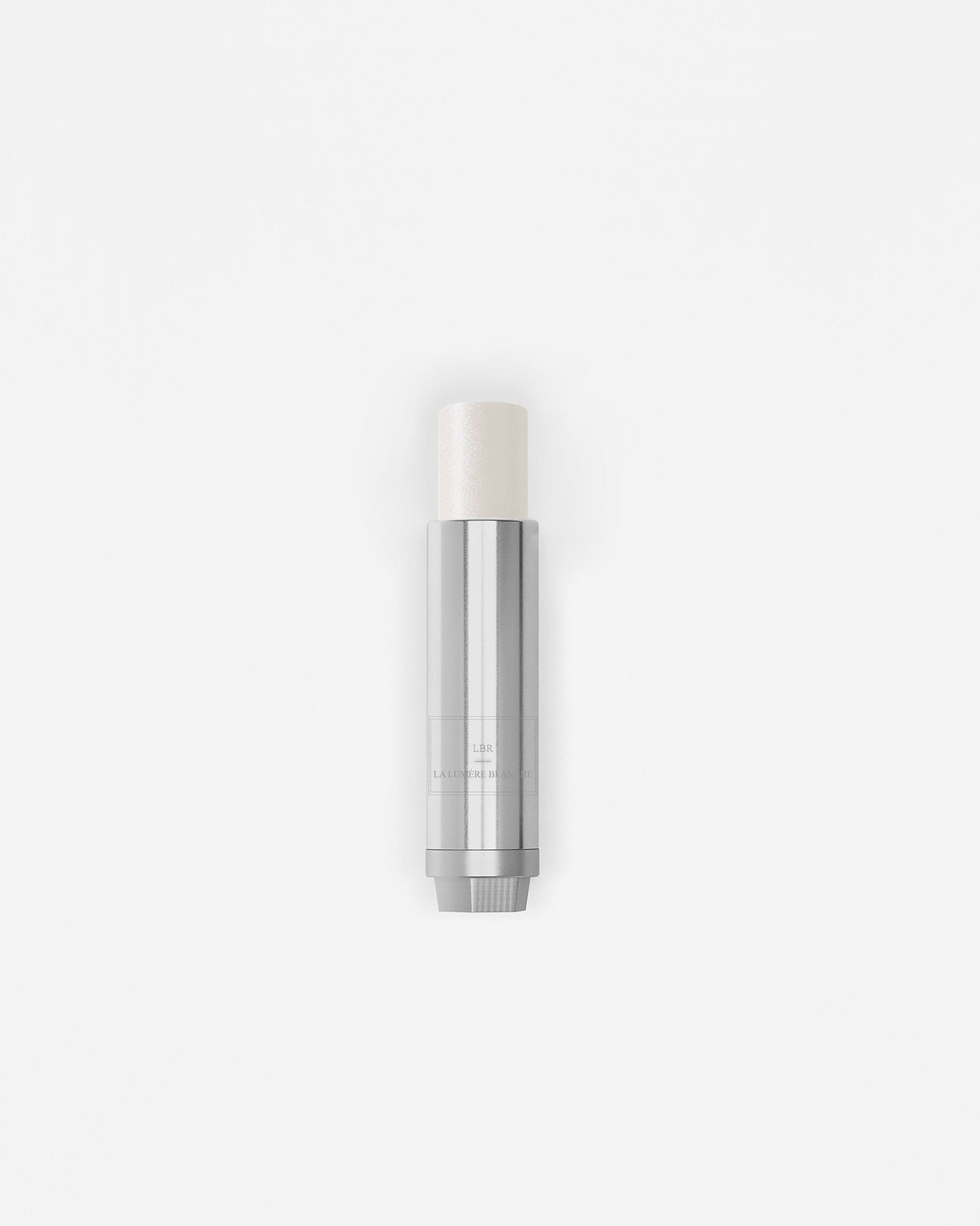 Stick enlumineur La Bouche Rouge Paris, teinte blanche pour un éclat lumineux et naturel, présenté dans un emballage élégant.