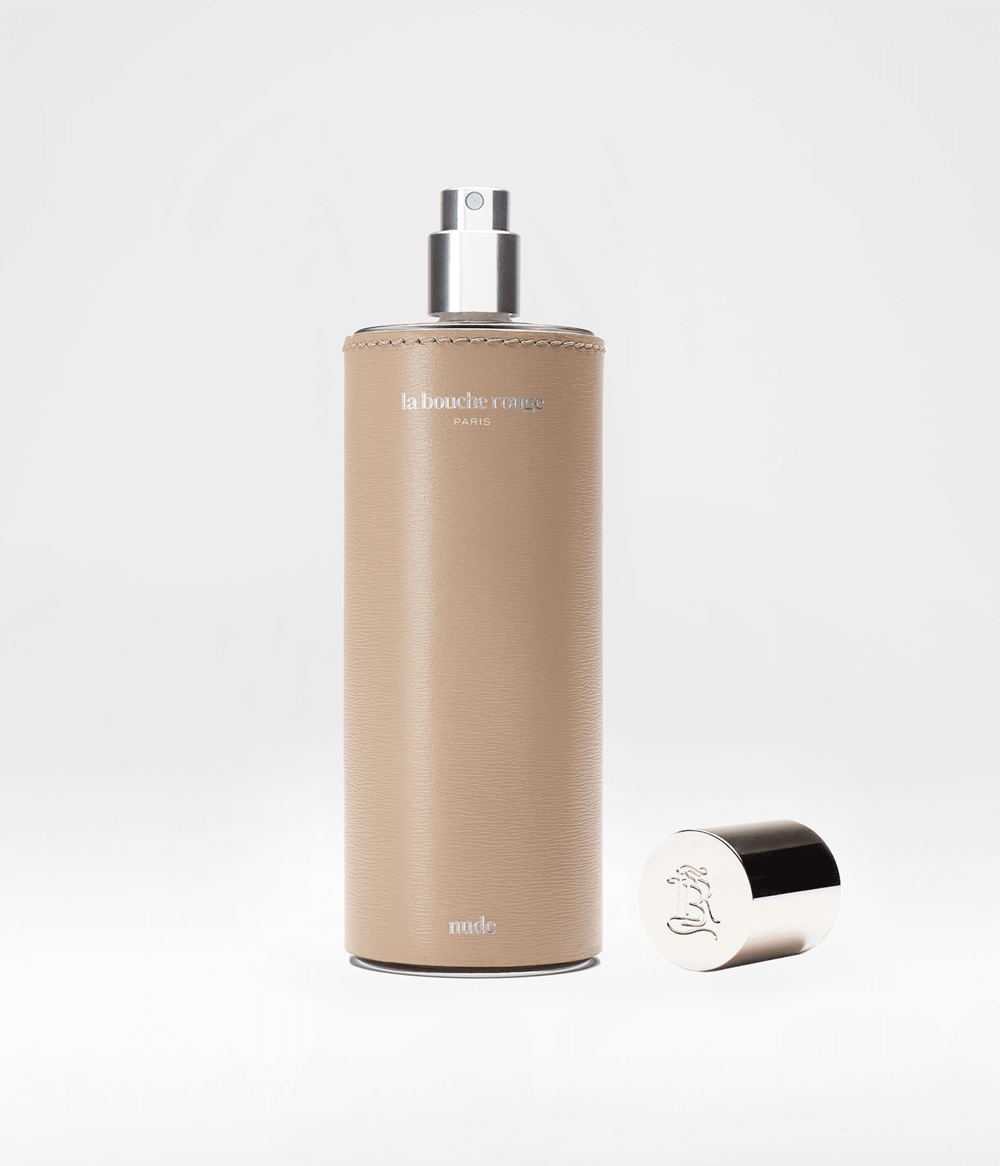 Flacon de parfum Nude La Bouche Rouge Paris, 100ml, avec vaporisateur, présenté ouvert, parfum nude élégant et sophistiqué.