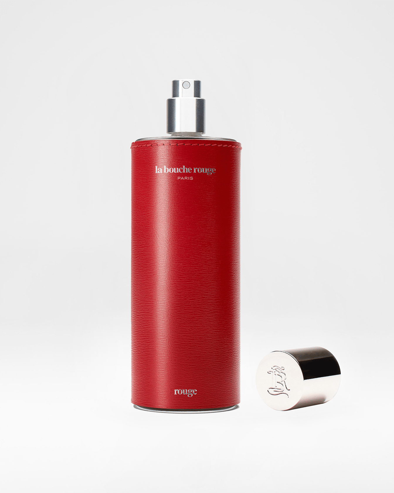 Flacon de parfum Rouge La Bouche Rouge Paris ouvert, extrait de parfum 100ml avec design élégant et sophistiqué.