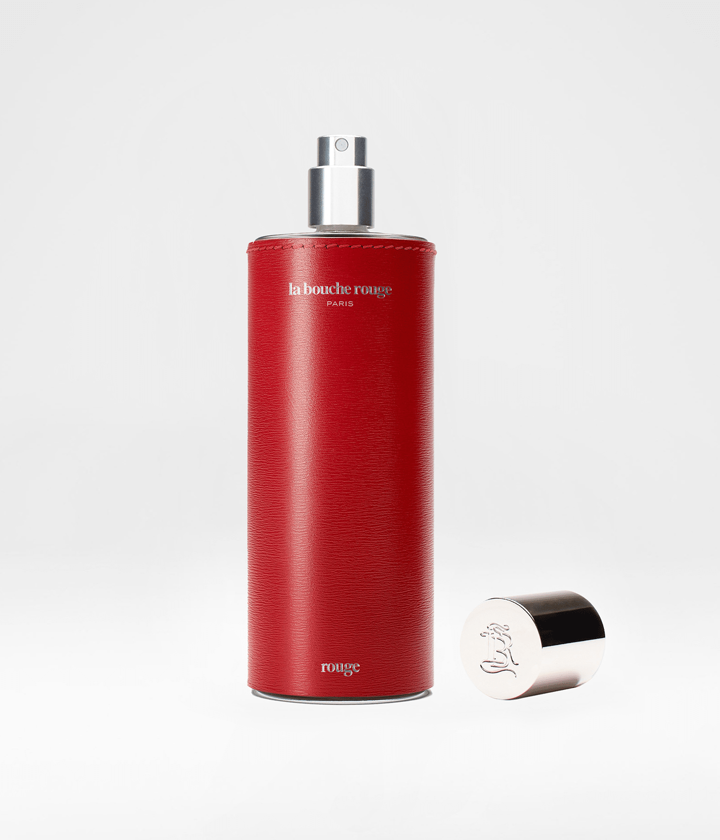 Flacon de parfum Rouge La Bouche Rouge Paris ouvert, extrait de parfum 100ml avec design élégant et sophistiqué.