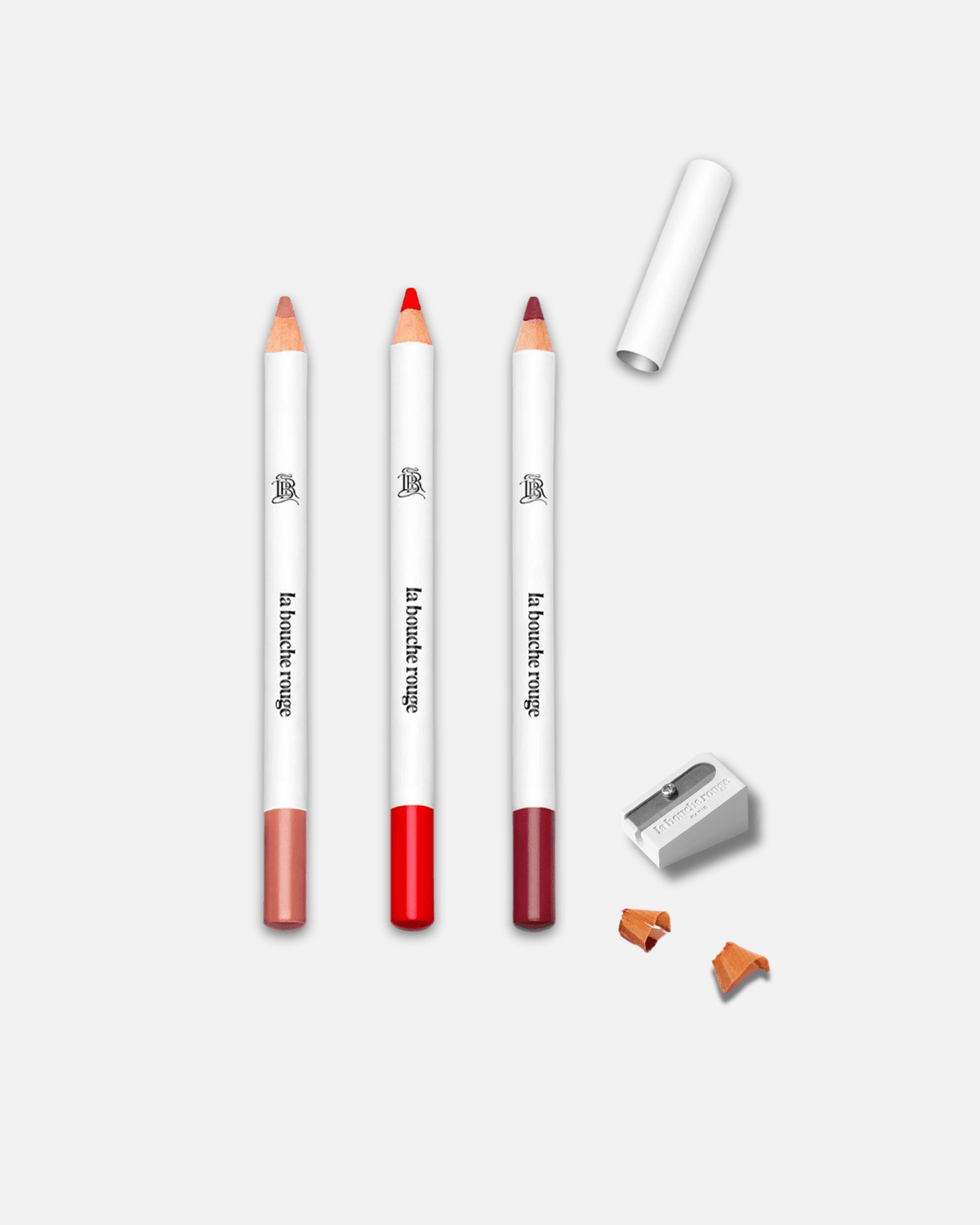 Ensemble de trois crayons à lèvres La Bouche Rouge Paris dans un coffret de contour signature.