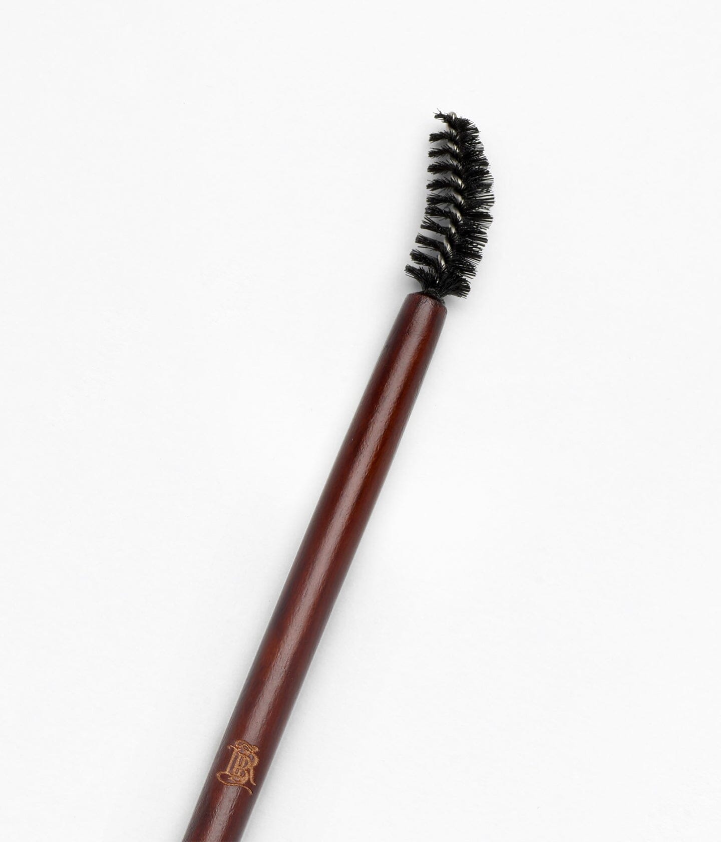 Brosse à sourcils La Bouche Rouge Paris, pinceau pour peigner et définir les sourcils, image montrant la brosse fine et élégante.