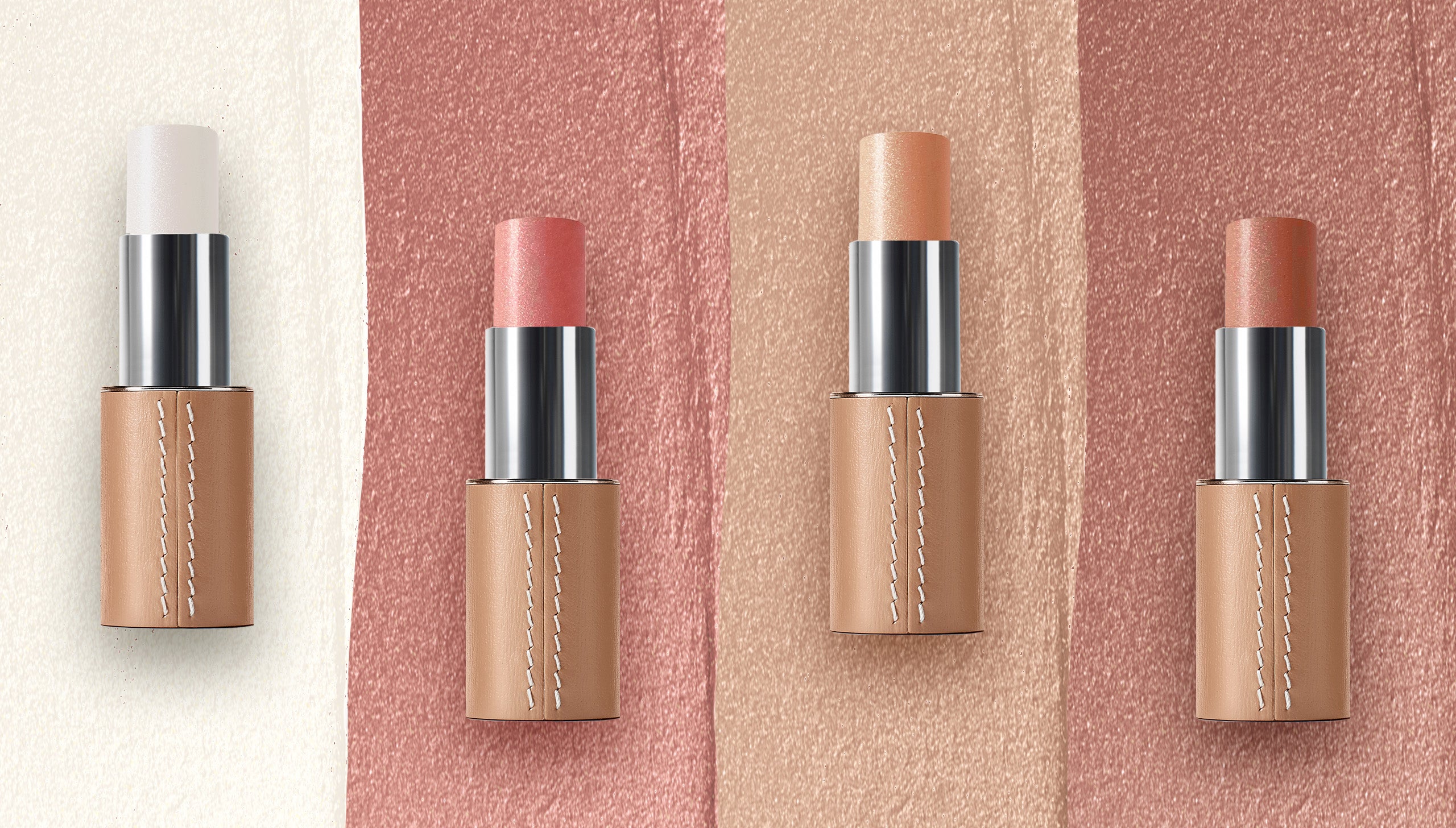 Gamme de stick enlumineur dans un écrin en cuir rechargeable et texture en fond