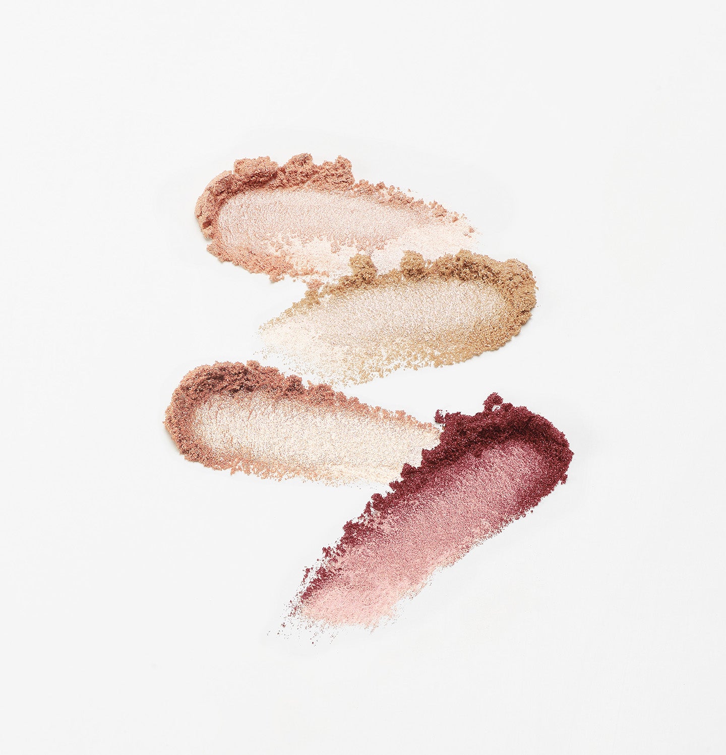 Textures des quatre ombres à paupières irisées de la palette Les Ombres Salton La Bouche Rouge – tons rosés, bruns et dorés sur fond blanc