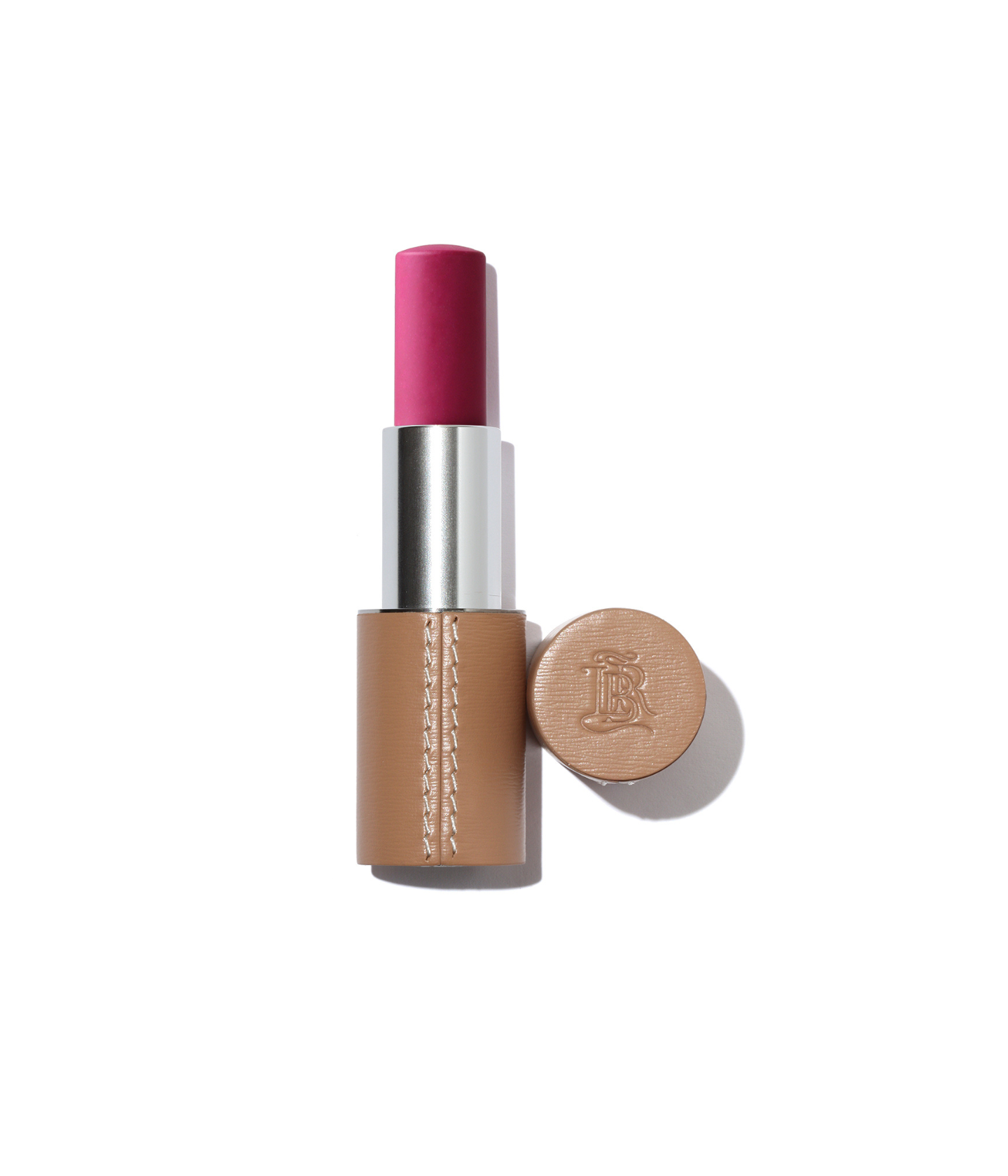 Stick blush rechargeable La Bouche Rouge teinte Néon Rose, présenté dans un écrin en cuir camel avec capot assorti